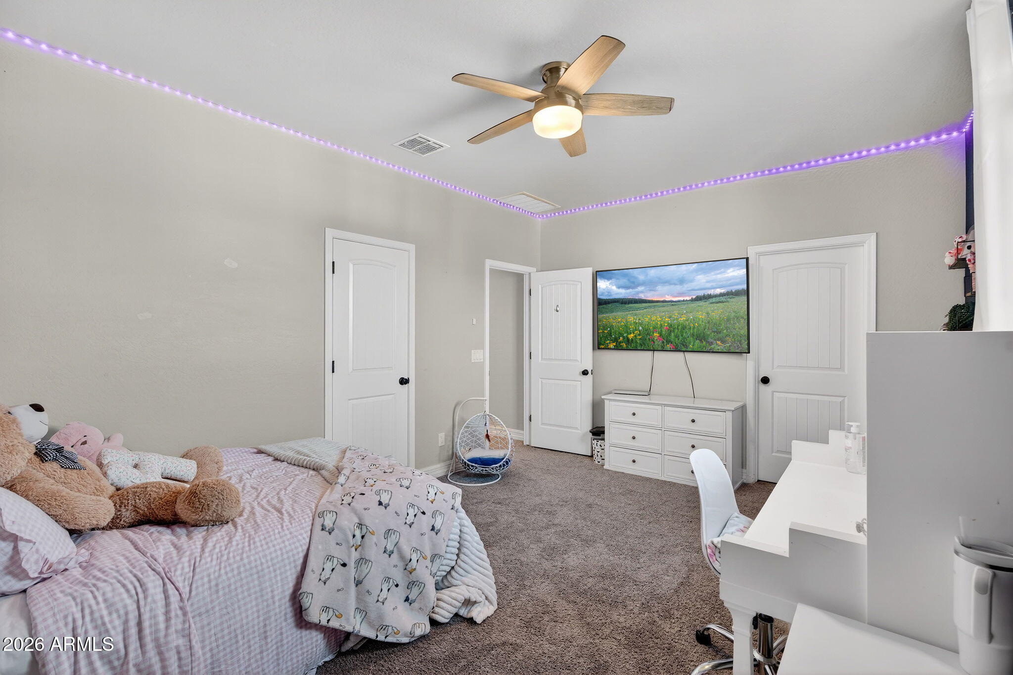 1663 West Gordon Street San Tan Valley, AZ 85144 - Photo 36 of 54 a living room with furniture and a flat screen tv