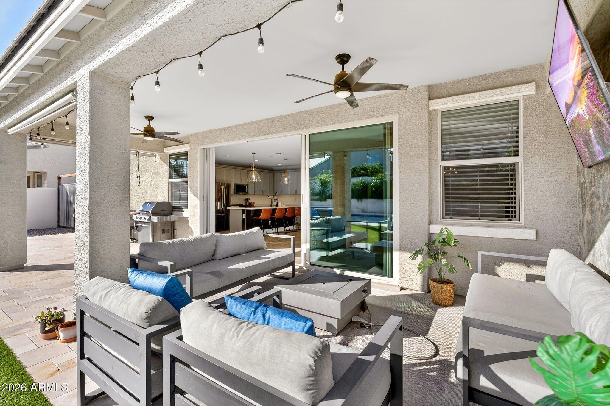 1663 West Gordon Street San Tan Valley, AZ 85144 - Photo 43 of 54 a living room with furniture and a large window