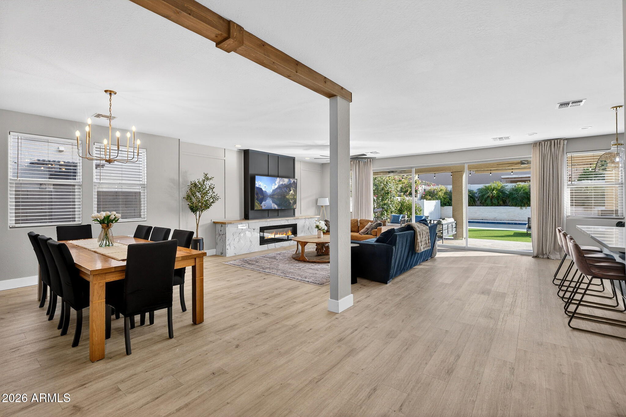 1663 West Gordon Street San Tan Valley, AZ 85144 - Photo 6 of 54 a view of a dining room with furniture window and wooden floor