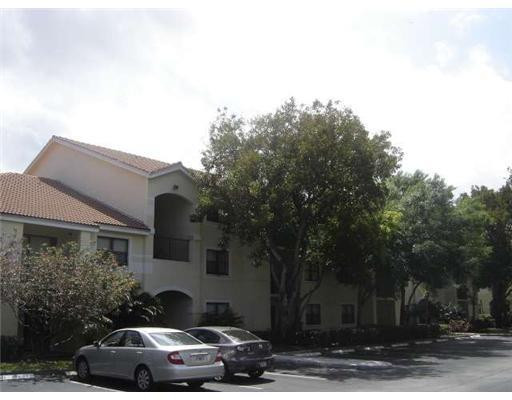 560 South Park Road, Unit 117 Hollywood, FL 33021 - Photo 1 of 8 a car parked in front of a house