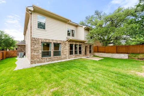 a view of yard with swimming pool and green space