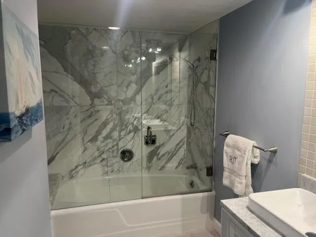 a bathroom with a shower and toilet