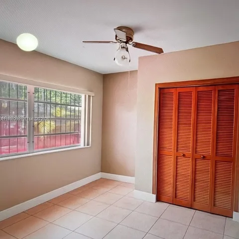 a view of a room that has a window in it