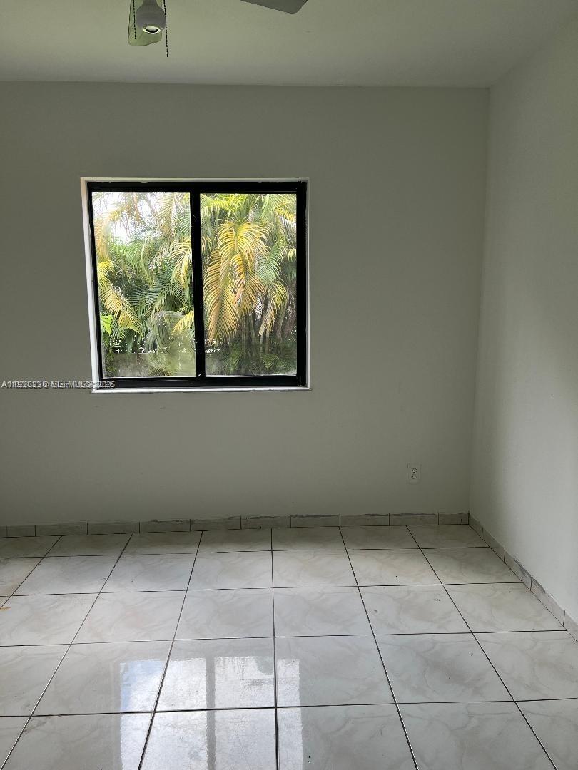 6385 Southwest 25th Street Miami, FL 33155 - Photo 15 of 26 a view of a room that has a window in it