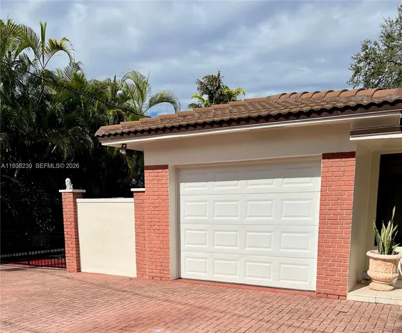 a potted plant sitting on the side of a building