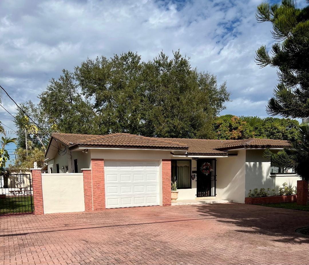 6385 Southwest 25th Street Miami, FL 33155 - Photo 3 of 26 a view of a house with a outdoor space