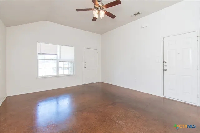 a kitchen with a refrigerator a stove top oven
