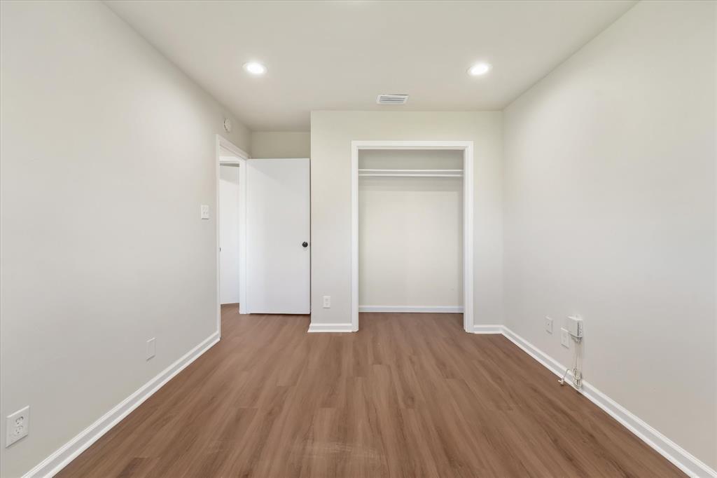 304 East Stone Road Wylie, TX 75098 - Photo 12 of 19 a view of a room with wooden floor