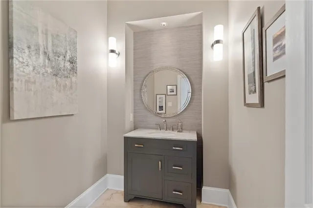 a large kitchen with a table and chairs