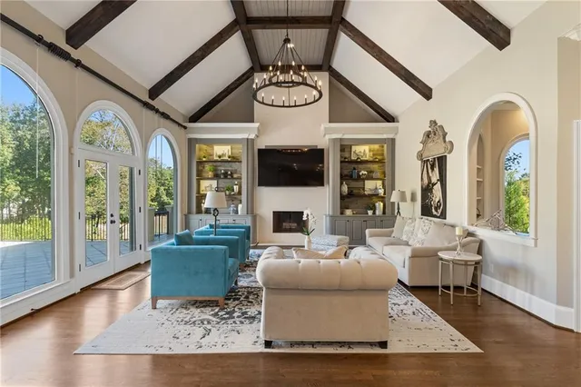 a kitchen with granite countertop a sink stove and cabinets