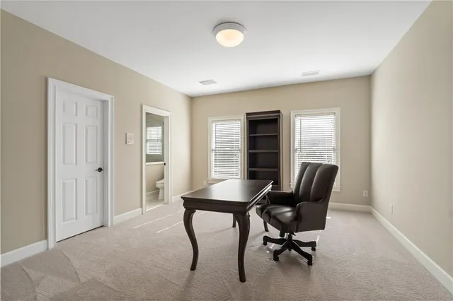 a living room with furniture wooden floor and a flat screen tv