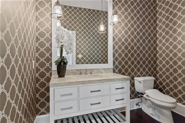 a view of a big building with big yard and large trees