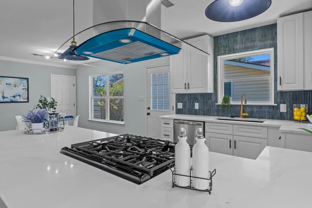 a kitchen with a table and chairs