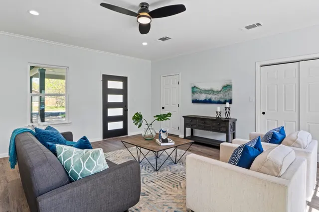 a living room with furniture and a fireplace