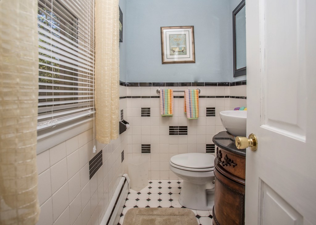 138 Sarah Sherman Road Rochester, MA 02770 - Photo 15 of 30 a bathroom with a toilet and a shower curtain