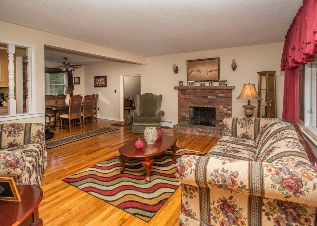 138 Sarah Sherman Road Rochester, MA 02770 - Photo 18 of 30 a living room with furniture and a fireplace
