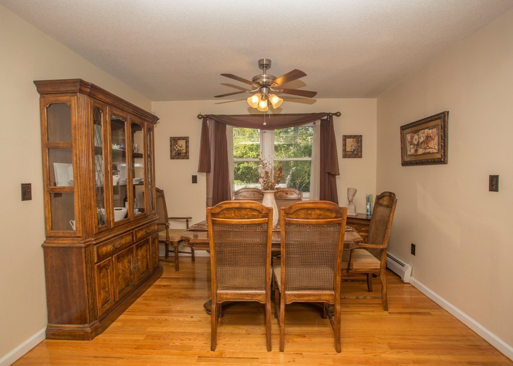 138 Sarah Sherman Road Rochester, MA 02770 - Photo 19 of 30 a view of a dining room with furniture window and wooden floor