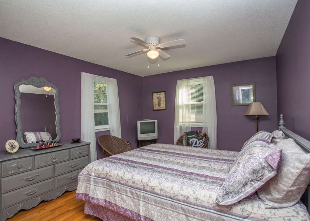 138 Sarah Sherman Road Rochester, MA 02770 - Photo 22 of 30 a bedroom with a bed and a mirror on dresser