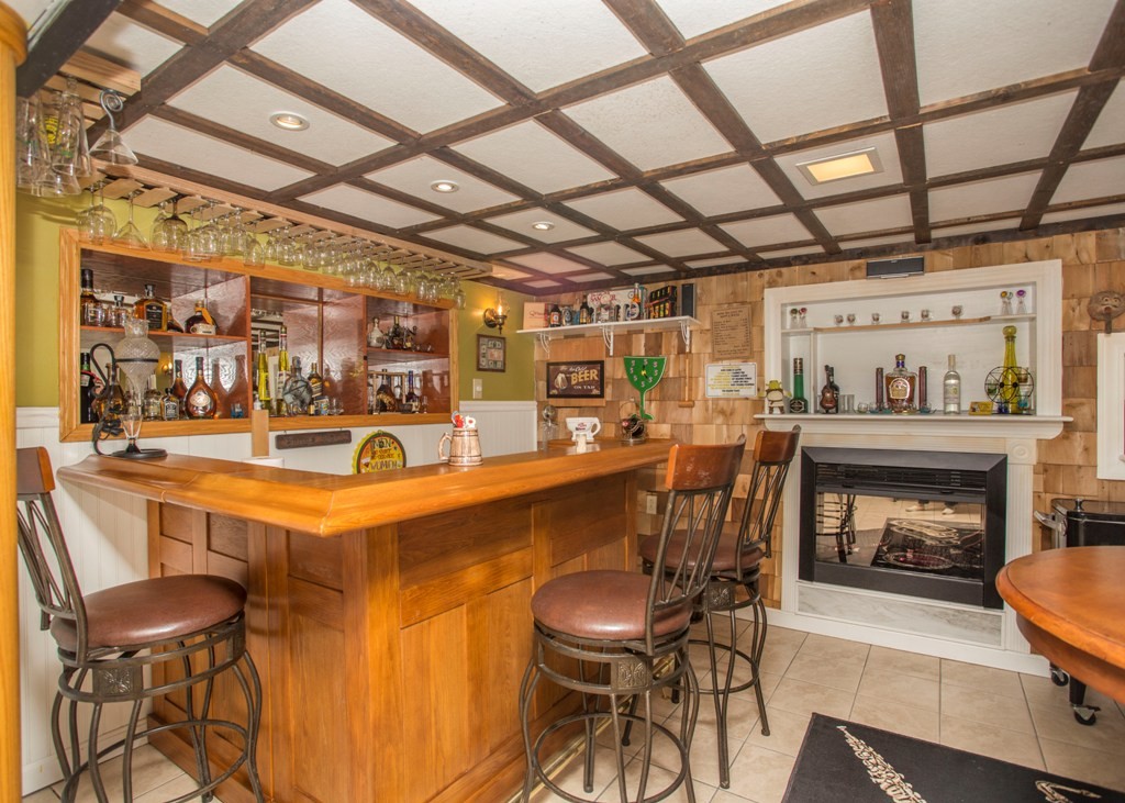 138 Sarah Sherman Road Rochester, MA 02770 - Photo 29 of 30 a dining room with furniture and a fireplace