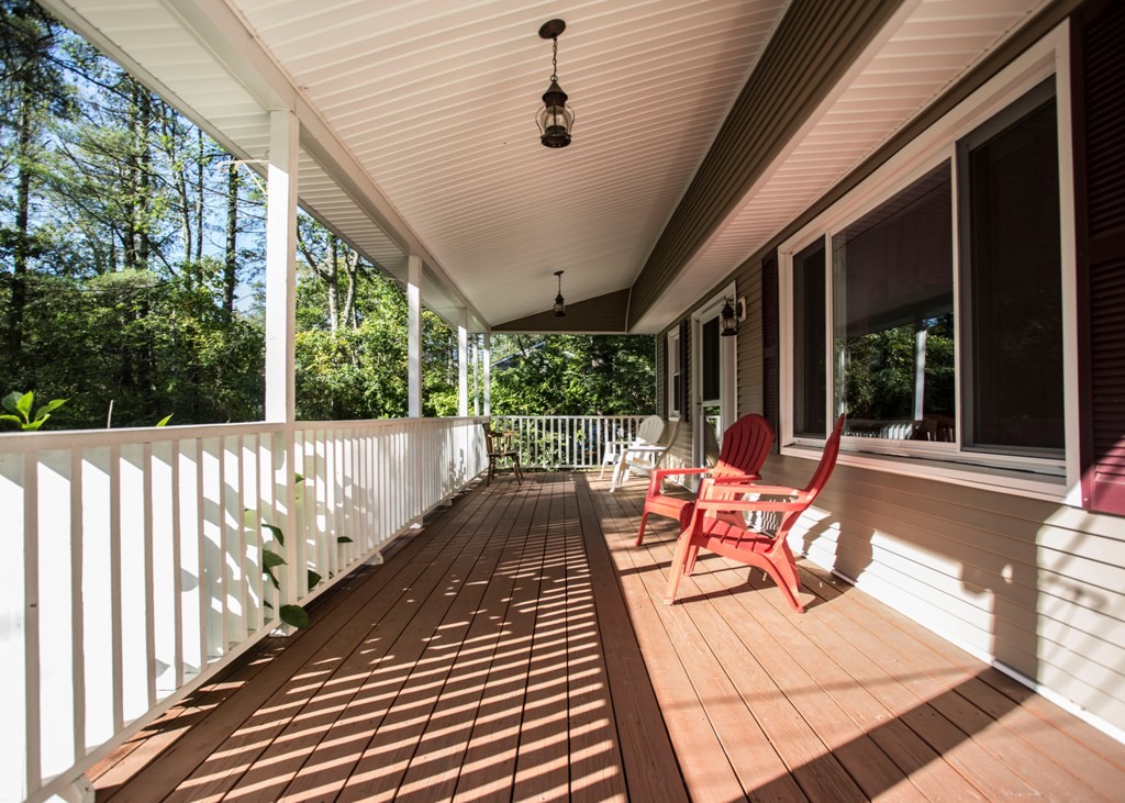 138 Sarah Sherman Road Rochester, MA 02770 - Photo 4 of 30 a balcony with chairs and wooden floor