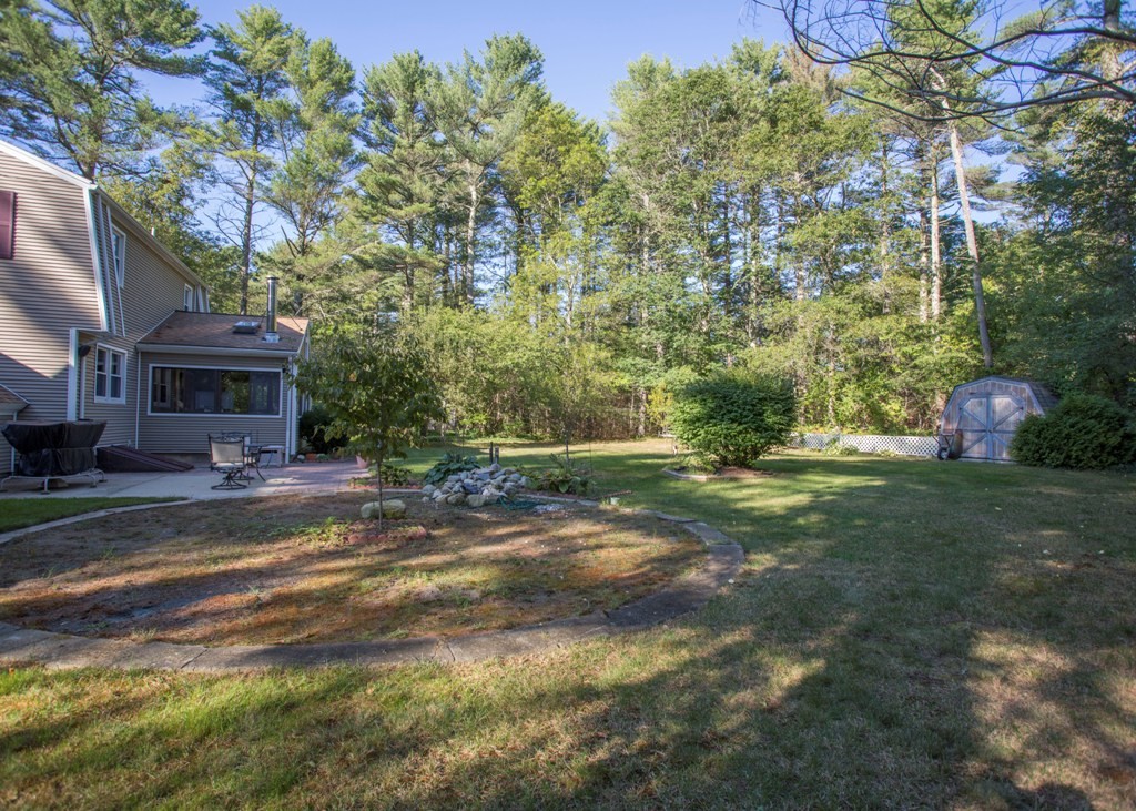 138 Sarah Sherman Road Rochester, MA 02770 - Photo 5 of 30 a view of a yard with plants and trees