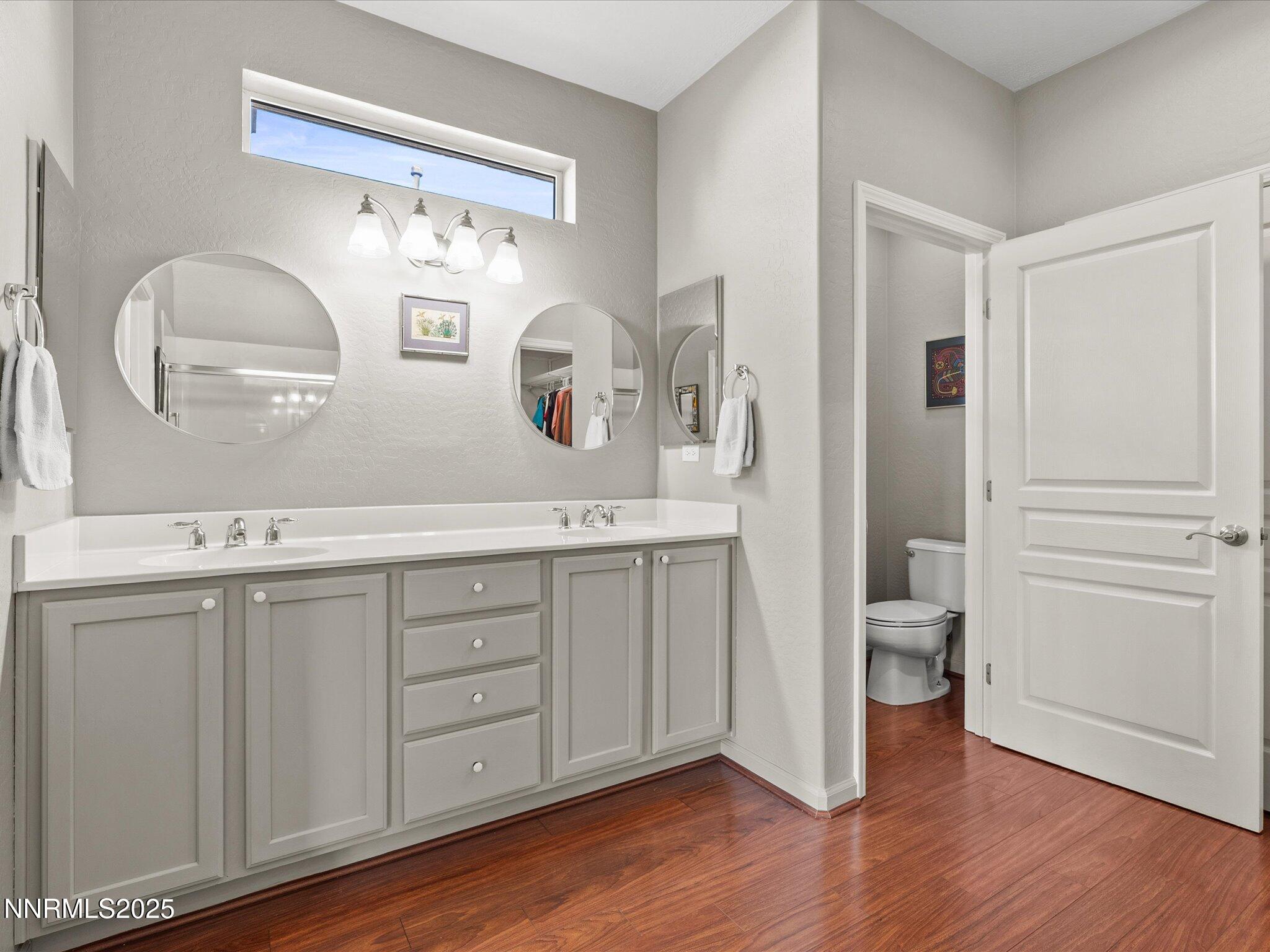 9052 Cabin Creek Trail Reno, NV 89523 - Photo 17 of 34 a spacious bathroom with a double vanity sink and a mirror
