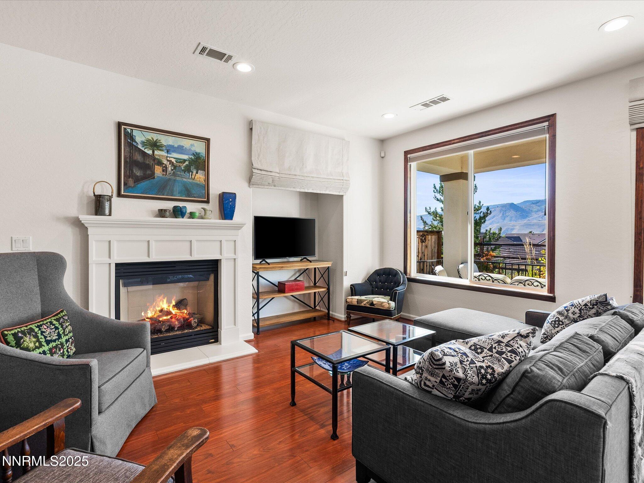 9052 Cabin Creek Trail Reno, NV 89523 - Photo 2 of 34 a living room with furniture couches and a fireplace