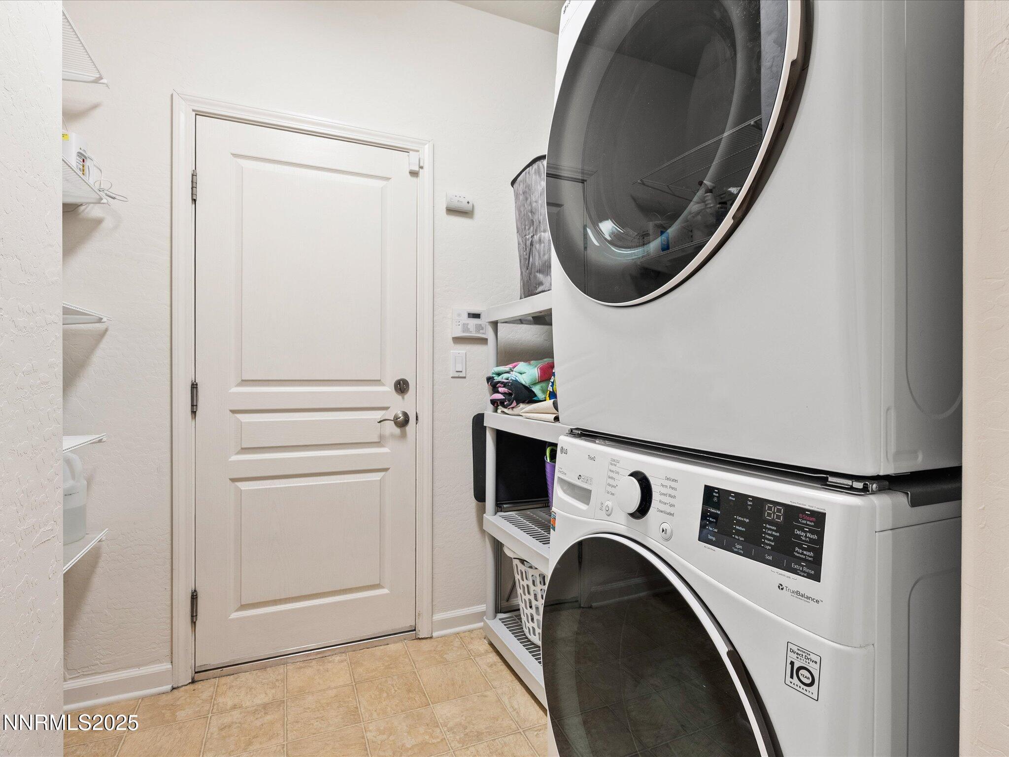 9052 Cabin Creek Trail Reno, NV 89523 - Photo 22 of 34 a utility room with dryer and washer