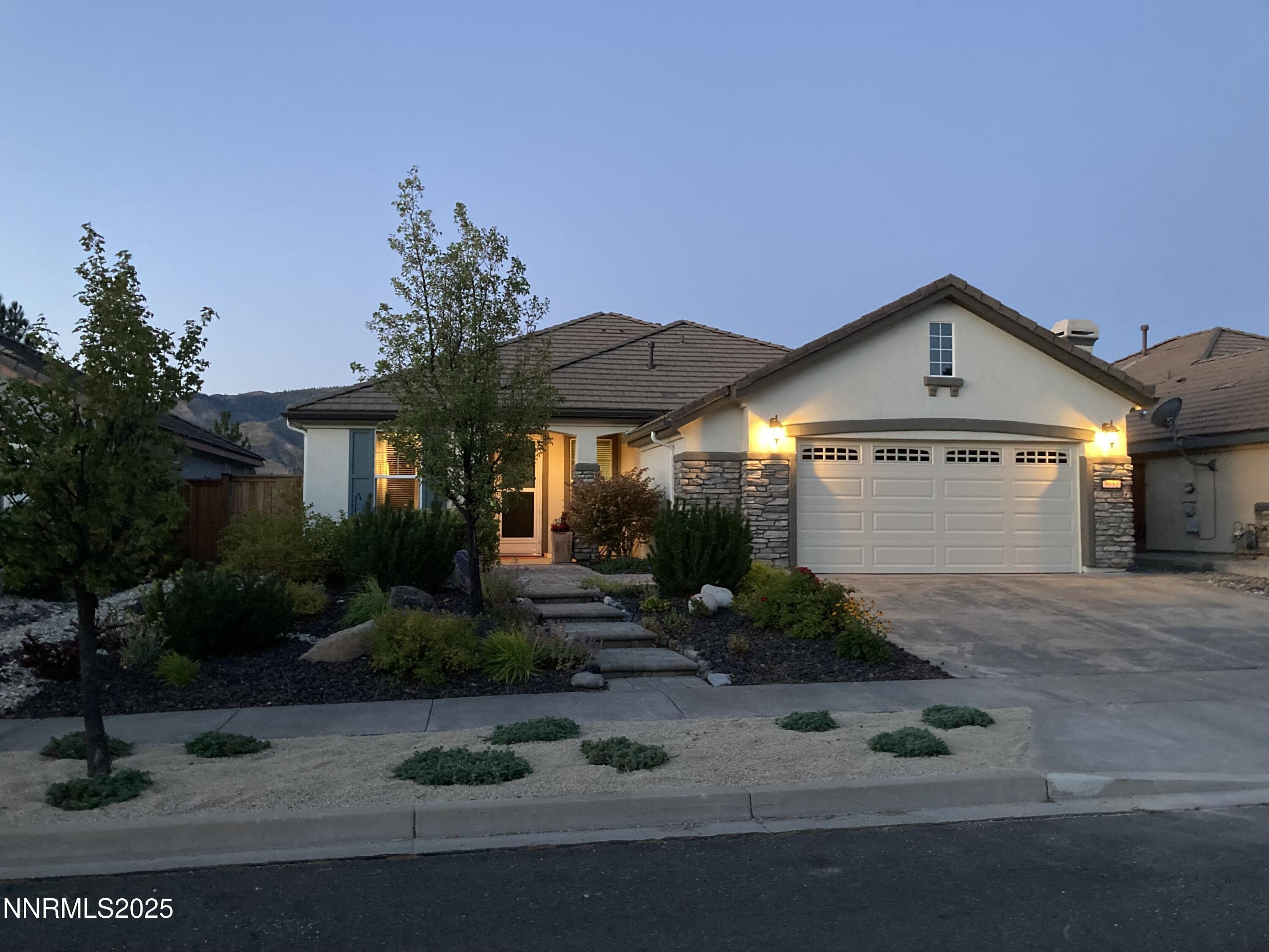 9052 Cabin Creek Trail Reno, NV 89523 - Photo 28 of 34 a front view of a house with garden