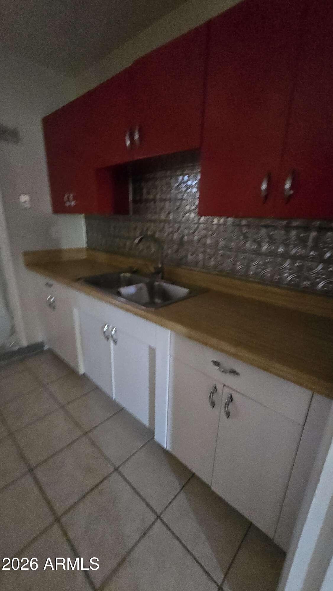 834 West Osborn Road Phoenix, AZ 85013 - Photo 6 of 45 a kitchen with a sink and cabinets