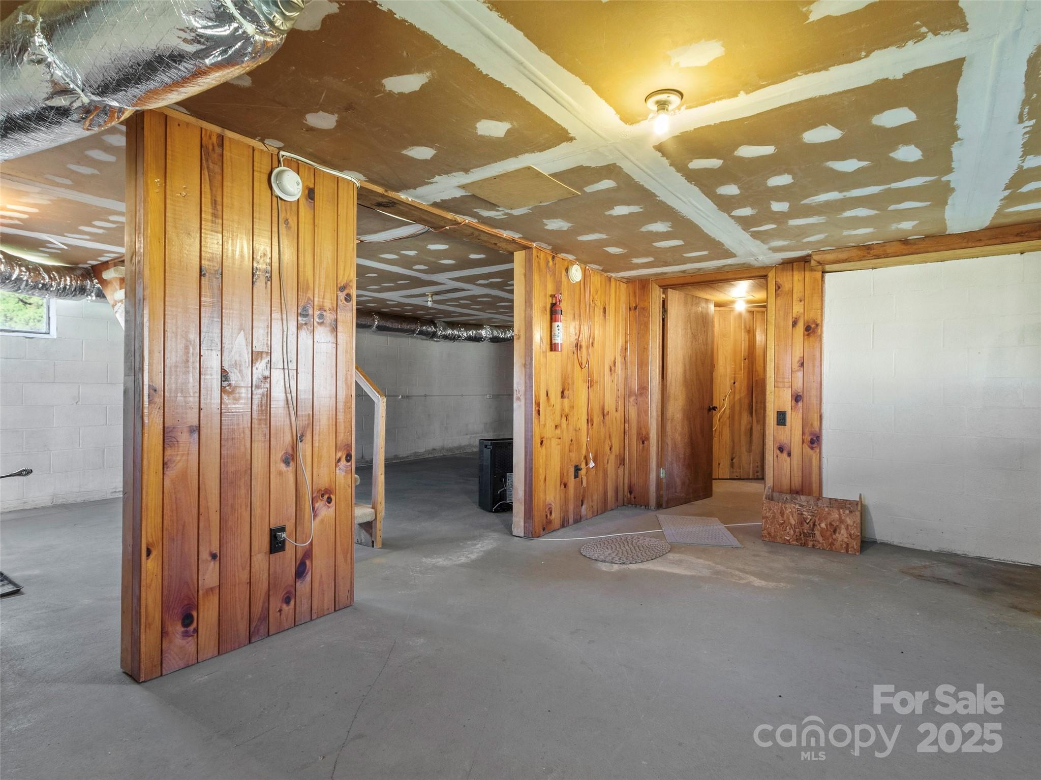 1879 White Oak Road Burnsville, NC 28714 - Photo 25 of 37 a view of a hallway with wooden walls