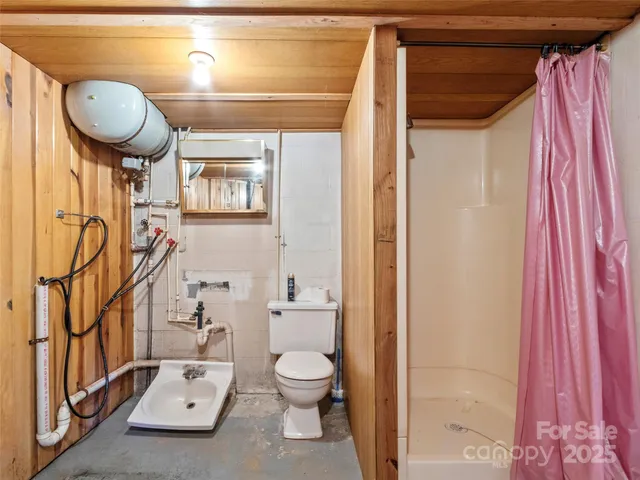 a picture of a room with a white wall and of a painting