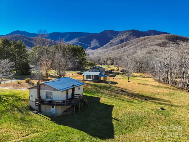 a view of a swimming pool with a table under an umbrella