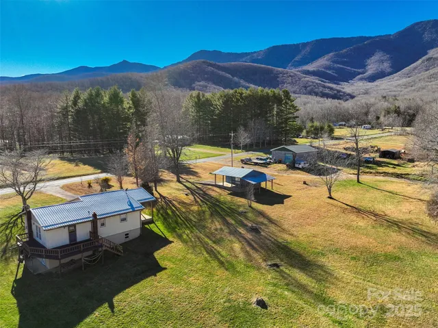 a view of a swimming pool with a yard