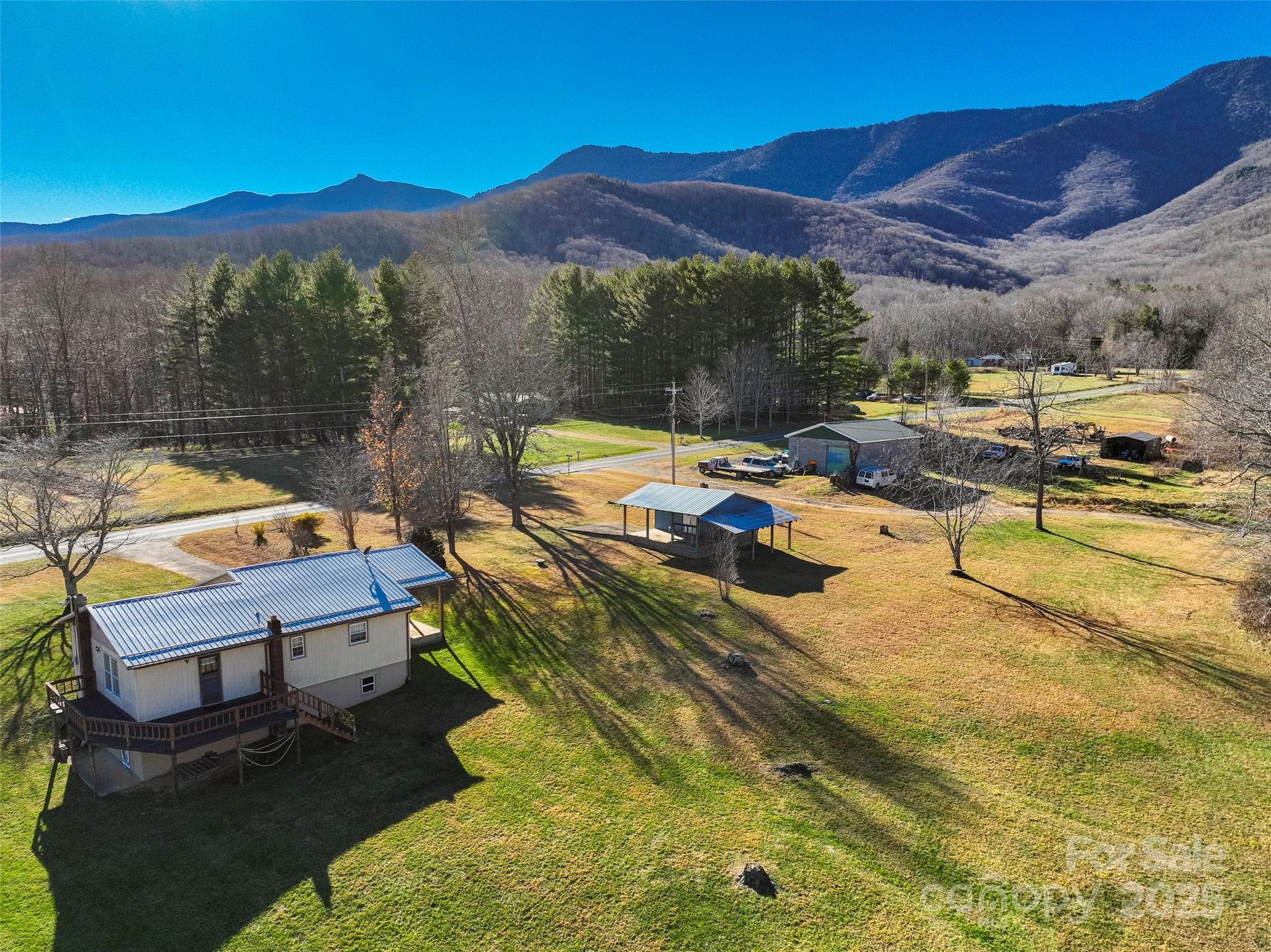 1879 White Oak Road Burnsville, NC 28714 - Photo 34 of 37 a view of a swimming pool with a table and chairs
