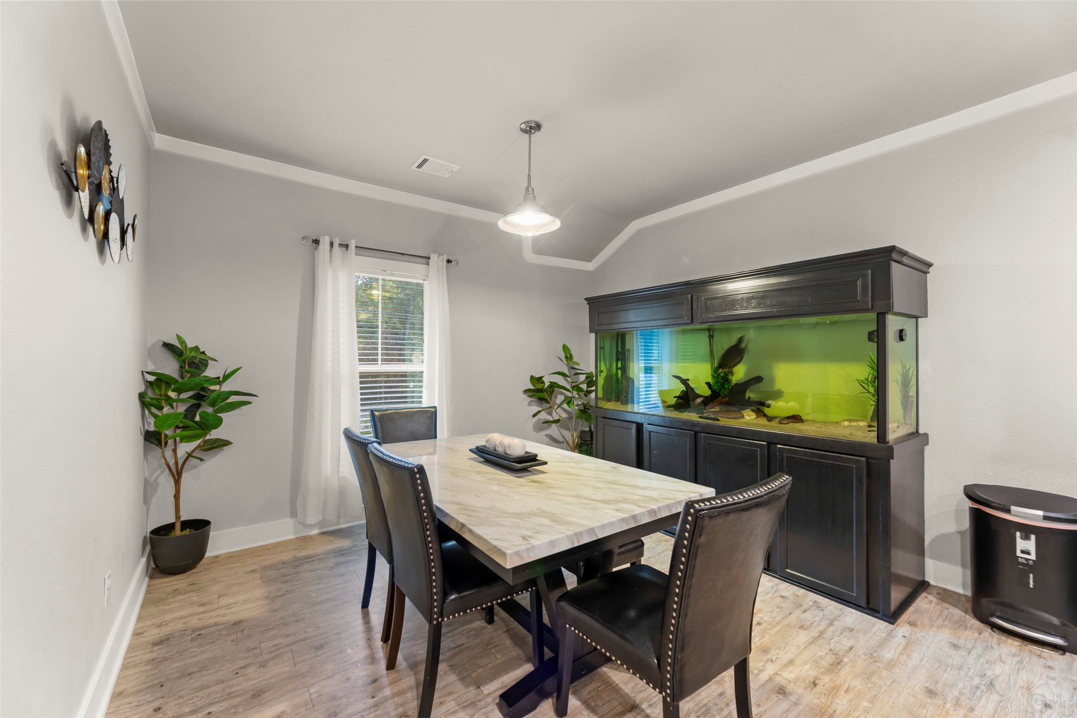 23918 Overcup Drive Spring, TX 77389 - Photo 12 of 37 a view of a dining room with furniture window and wooden floor