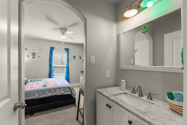 a bedroom with a bed and cabinets