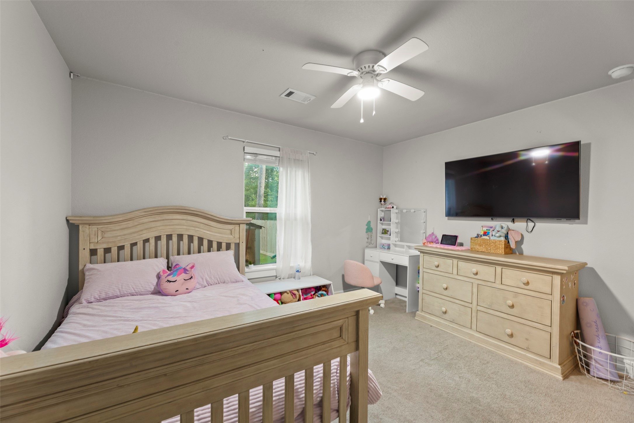 23918 Overcup Drive Spring, TX 77389 - Photo 20 of 37 a bedroom with a bed and a flat screen tv