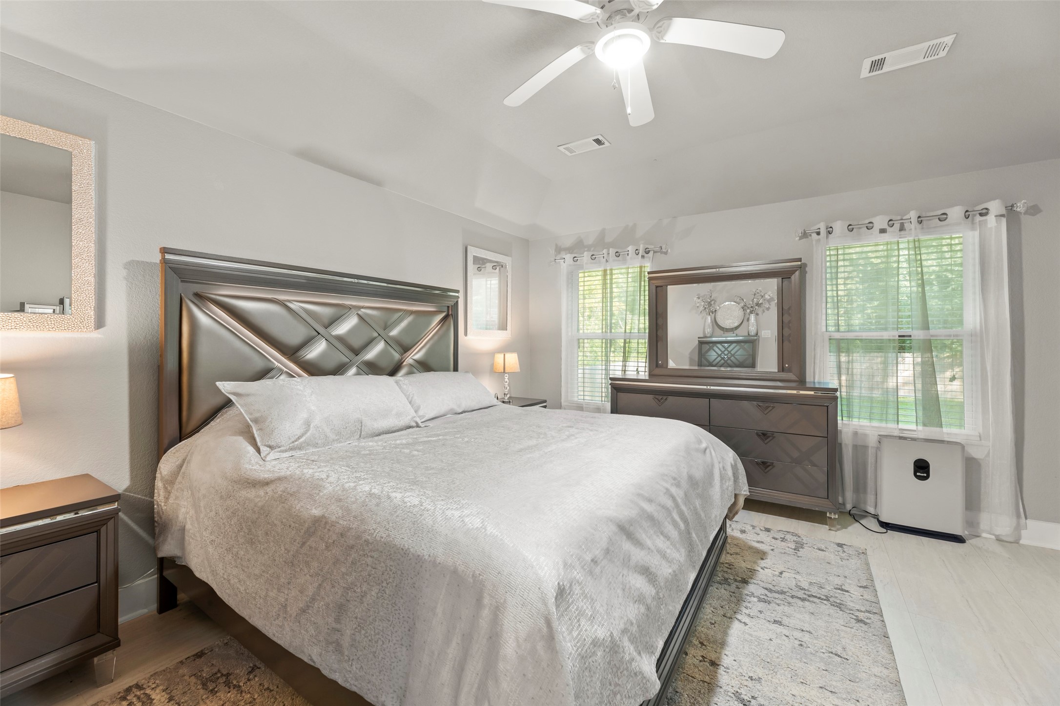 23918 Overcup Drive Spring, TX 77389 - Photo 23 of 37 a bedroom with a large bed and a window