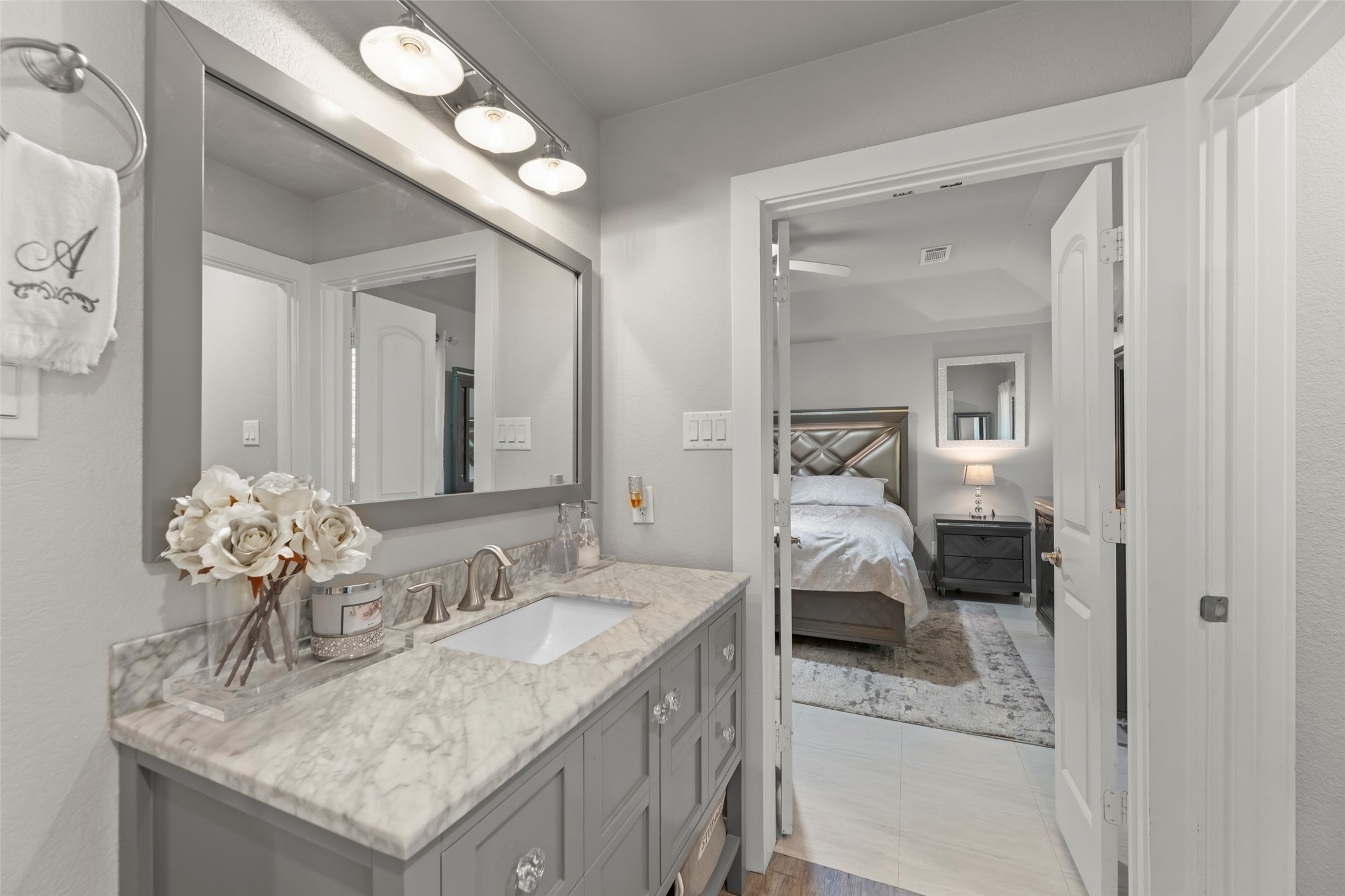 23918 Overcup Drive Spring, TX 77389 - Photo 26 of 37 a en suite bathroom with sinks granite countertop and a mirror