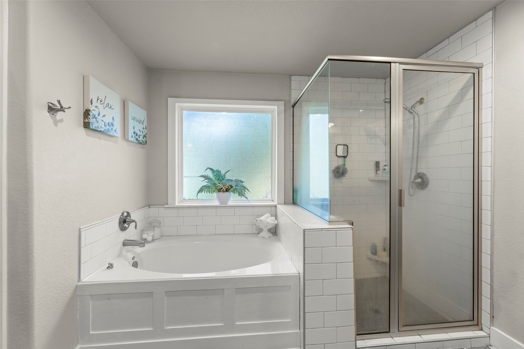 23918 Overcup Drive Spring, TX 77389 - Photo 27 of 37 a bathroom with a bathtub and shower