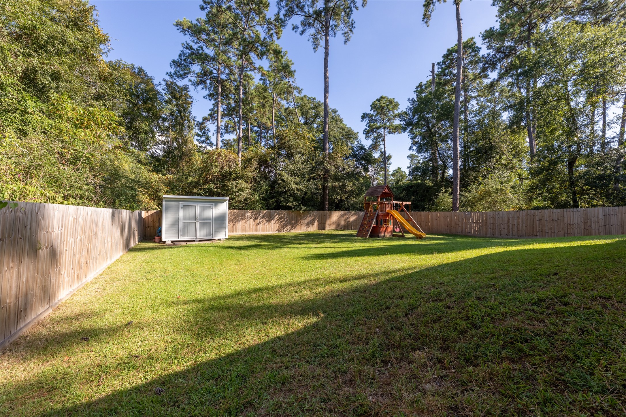 23918 Overcup Drive Spring, TX 77389 - Photo 32 of 37 a childrens park with lots of swings and slides