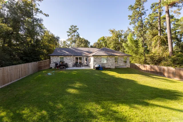 a front view of house with yard and seating area