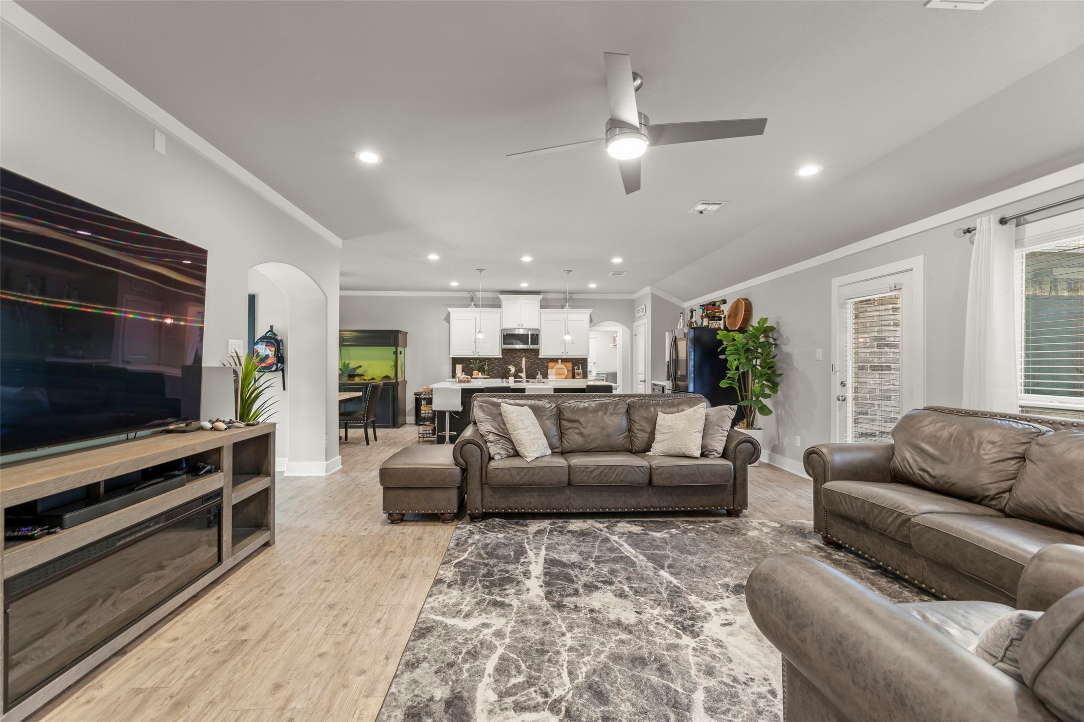 23918 Overcup Drive Spring, TX 77389 - Photo 6 of 37 a living room with furniture and a flat screen tv