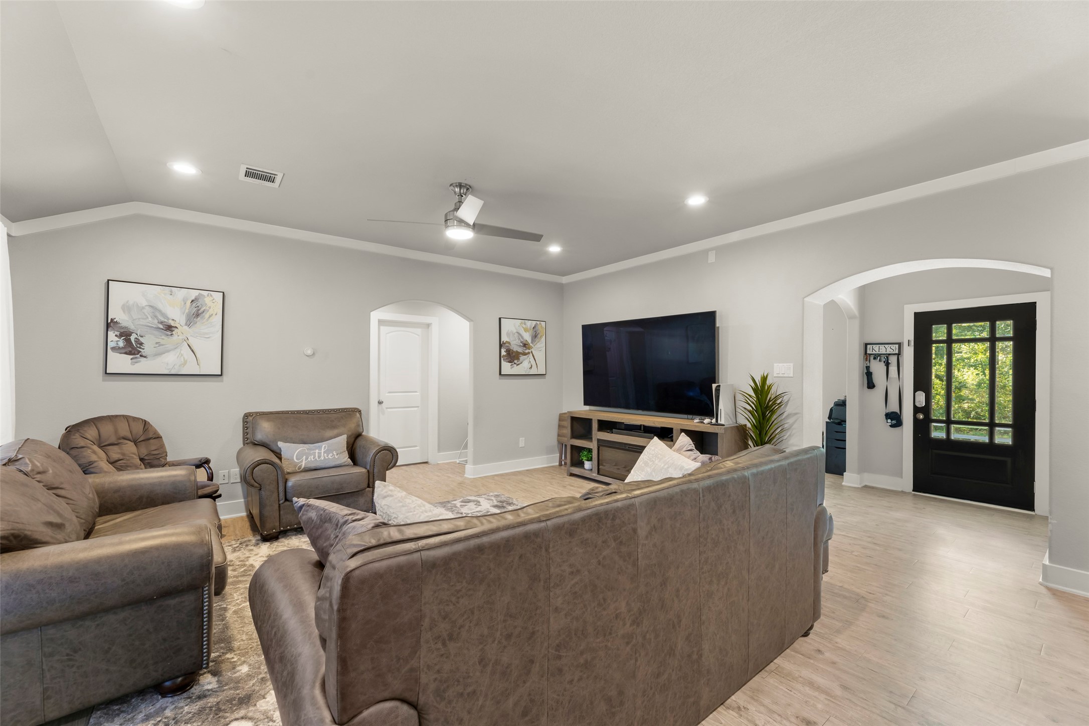 23918 Overcup Drive Spring, TX 77389 - Photo 8 of 37 a living room with furniture and a flat screen tv