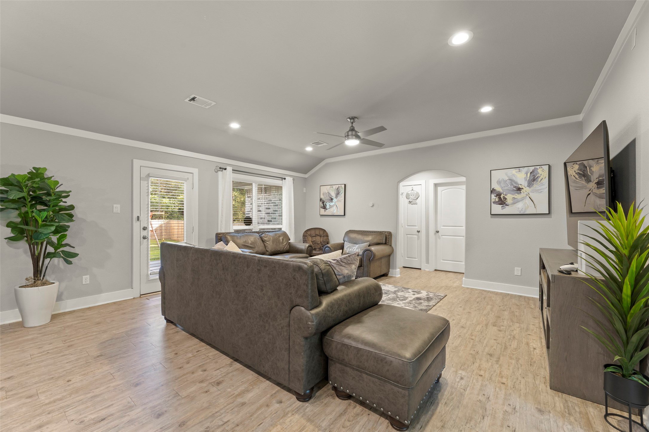 23918 Overcup Drive Spring, TX 77389 - Photo 9 of 37 a living room with furniture and a potted plant