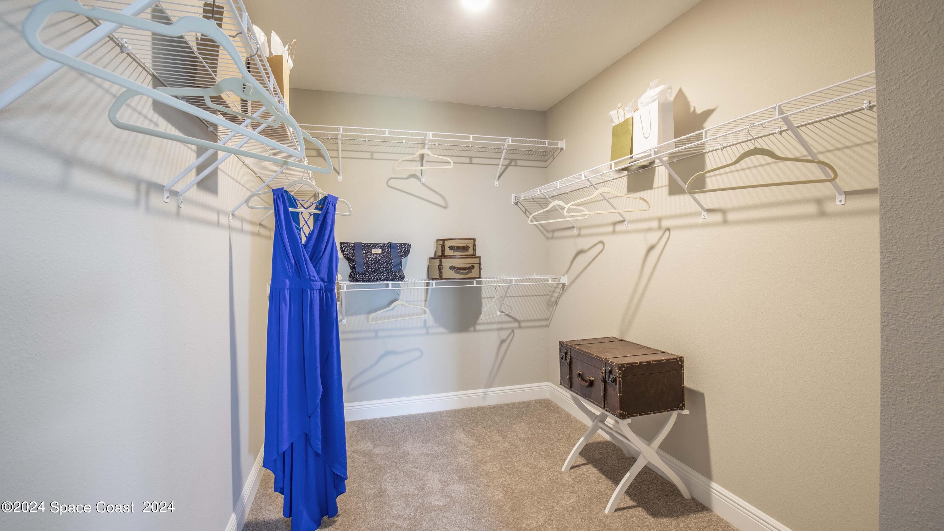 1448 Cygnus Place Merritt Island, FL 32953 - Photo 16 of 34 a view of storage and utility room with stairs