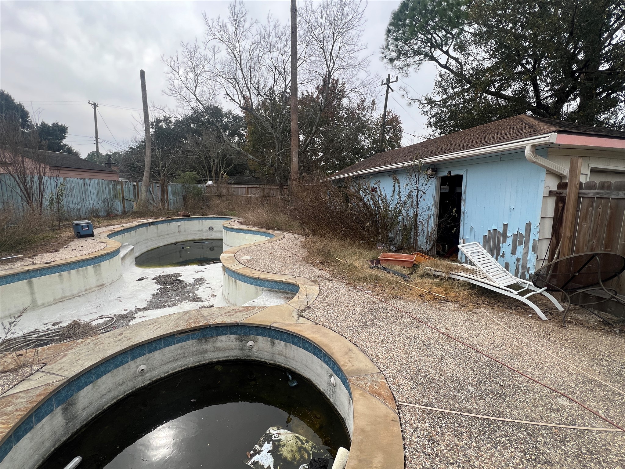 6023 Lattimer Drive Houston, TX 77035 - Photo 14 of 15 a view of backyard with barbeque and wooden fence