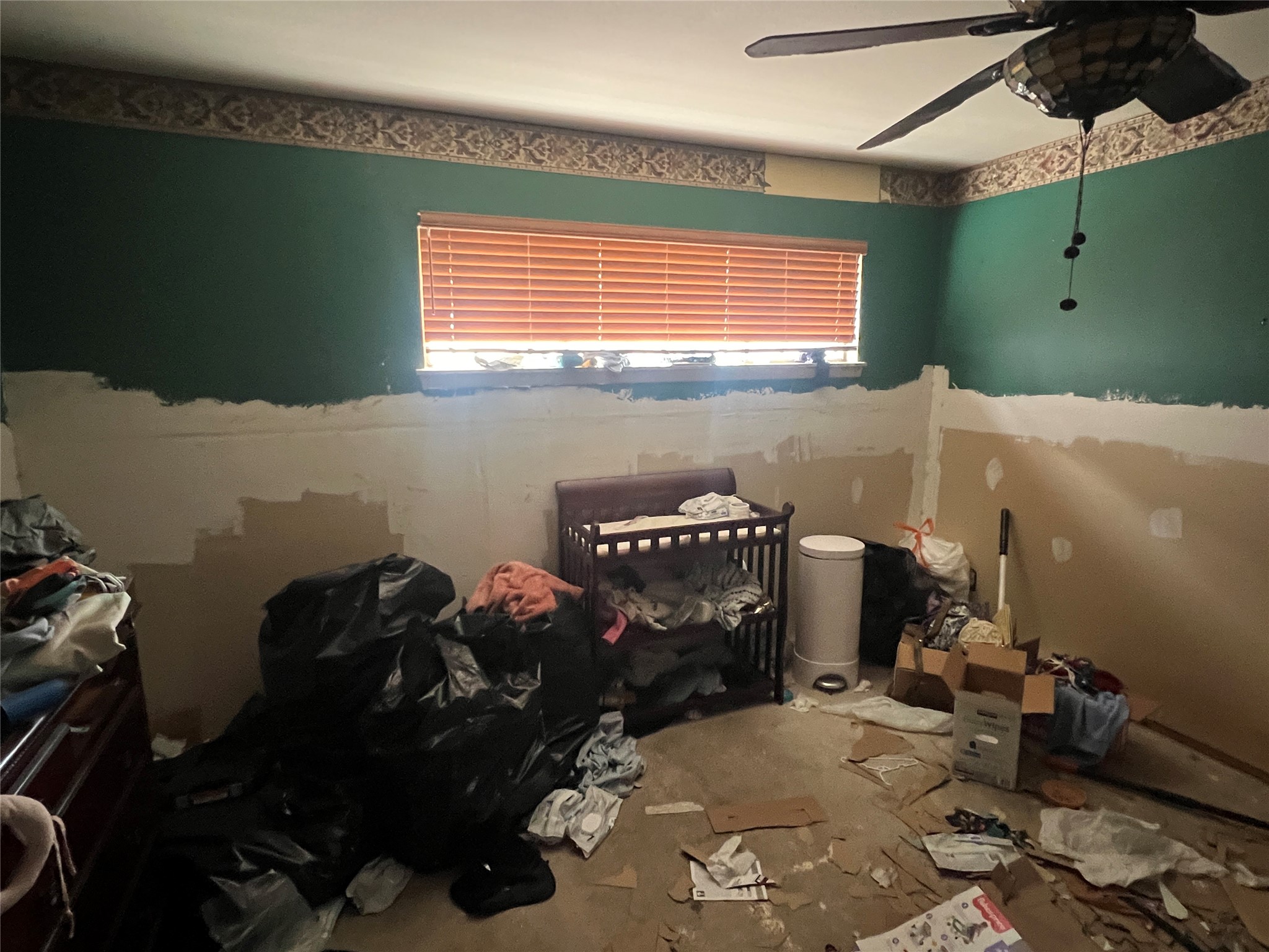 6023 Lattimer Drive Houston, TX 77035 - Photo 6 of 15 a bedroom with a bed and a window