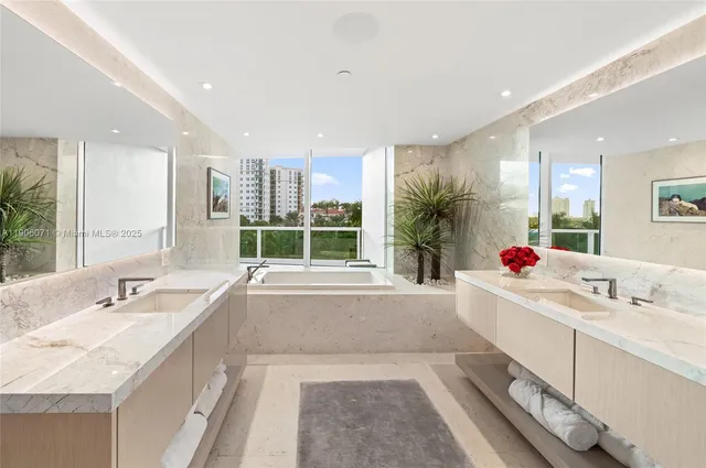a bathroom with a tub shower and sink